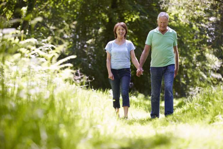 An older couple walking